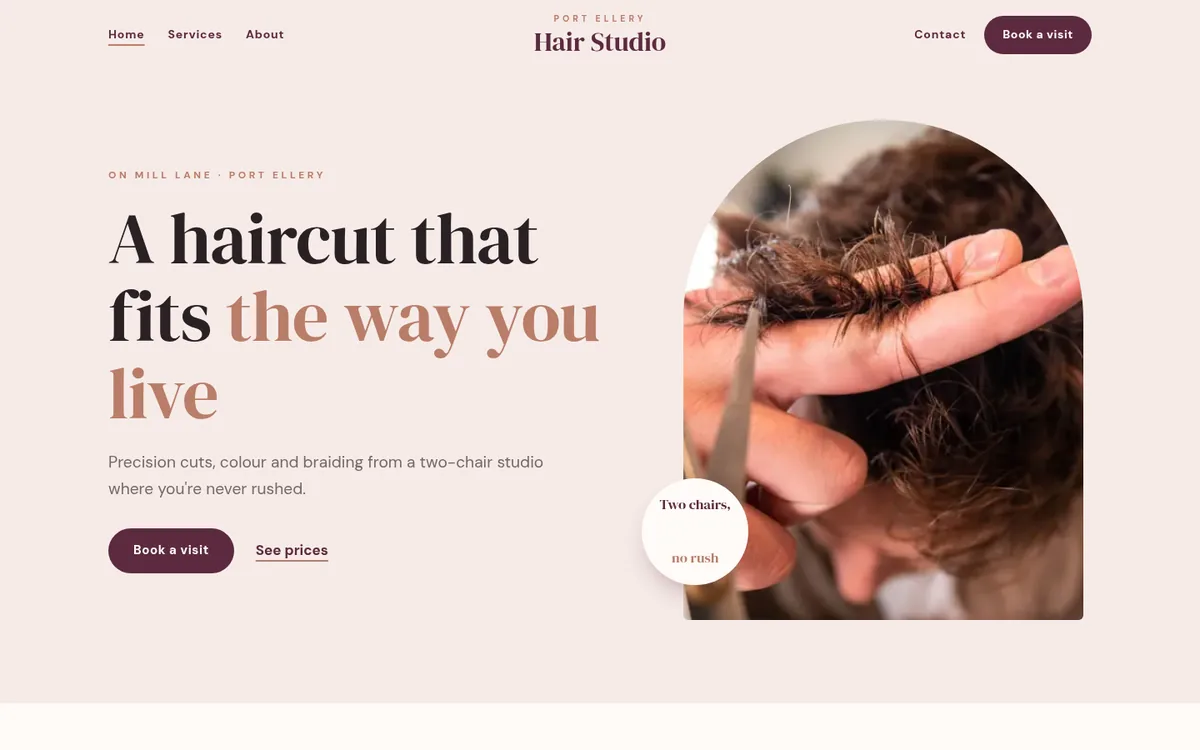 The home page of Port Ellery Hair Studio, a sample website, on a computer screen
